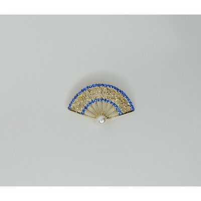 Broche brillantes dorado