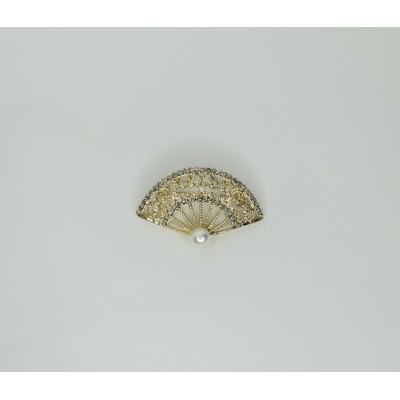 Broche brillantes dorado